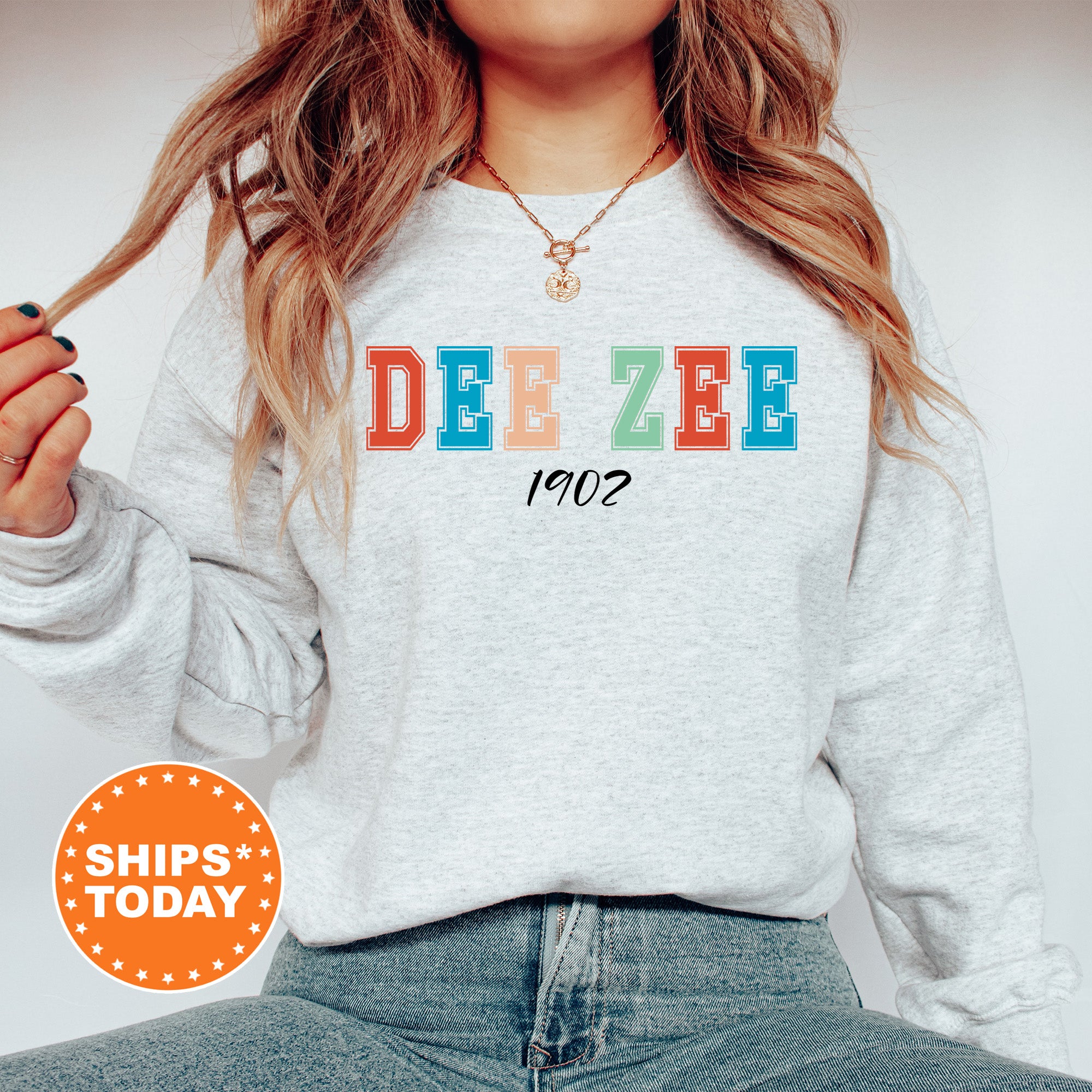 a woman wearing a sweatshirt with the word deze on it