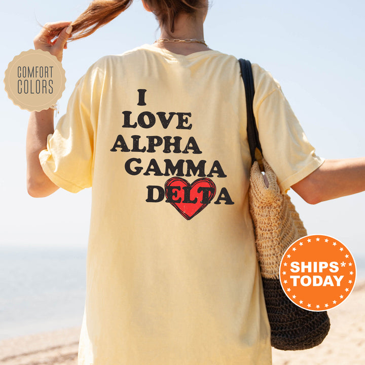a woman with a bag and a t - shirt that says i love alpha ga