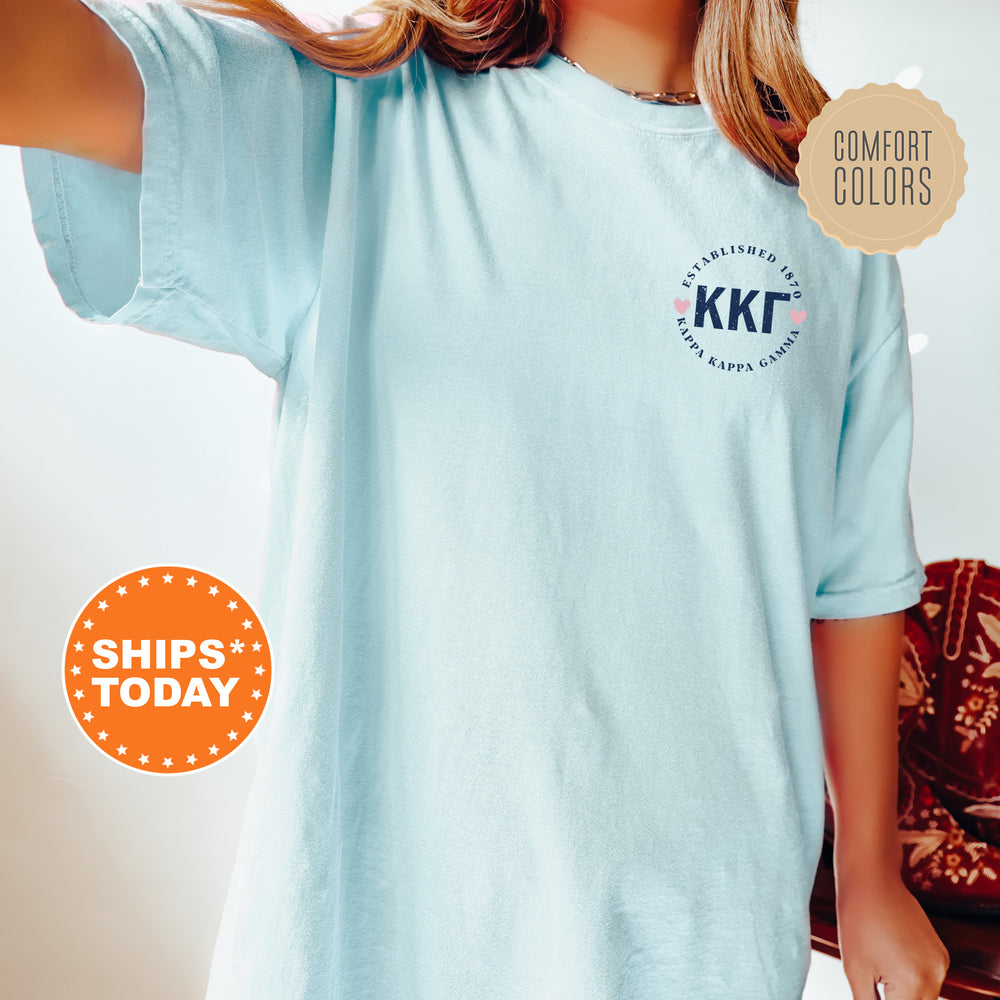 a woman wearing a blue t - shirt with the kkt logo on it