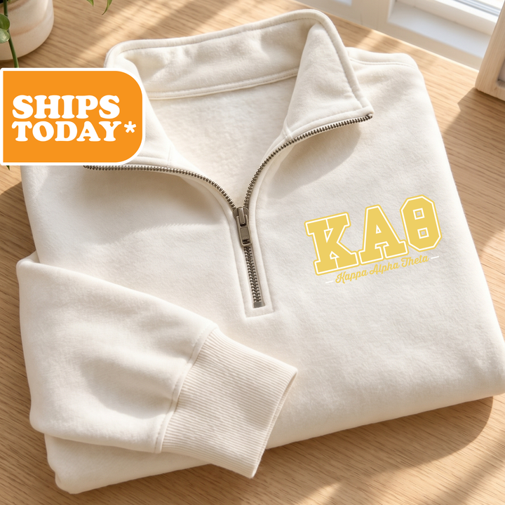 a white sweatshirt with a yellow ka9 logo on it