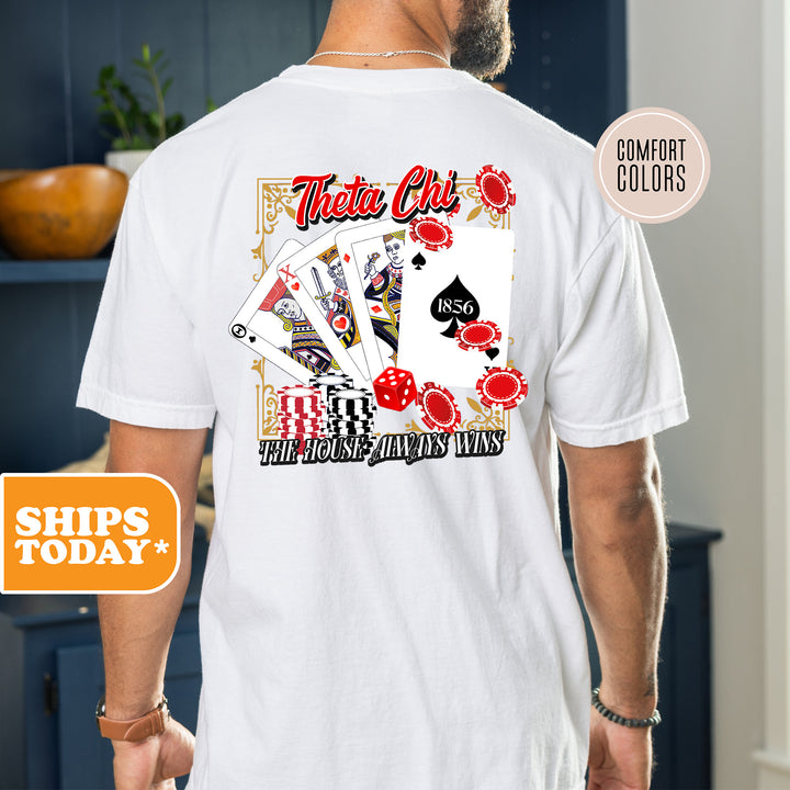 a man wearing a white t - shirt with a picture of a playing card
