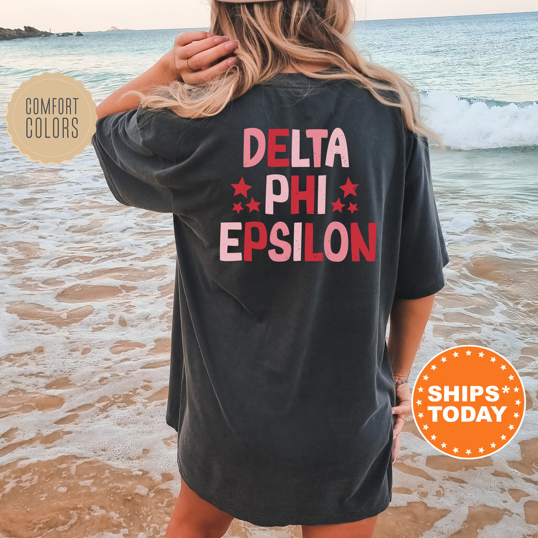 the back of a woman wearing a black shirt that says delta phi epsion