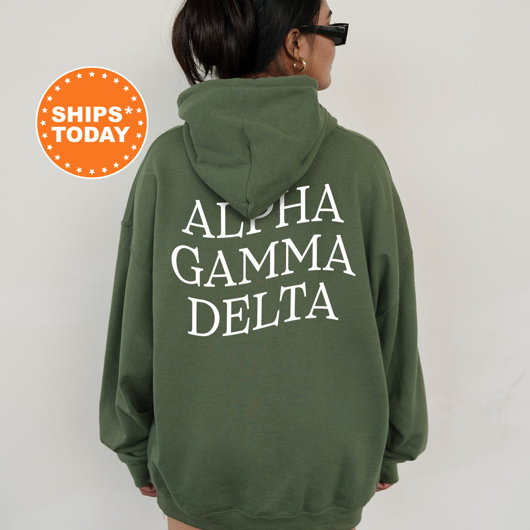 a woman wearing a green hoodie with white letters on it