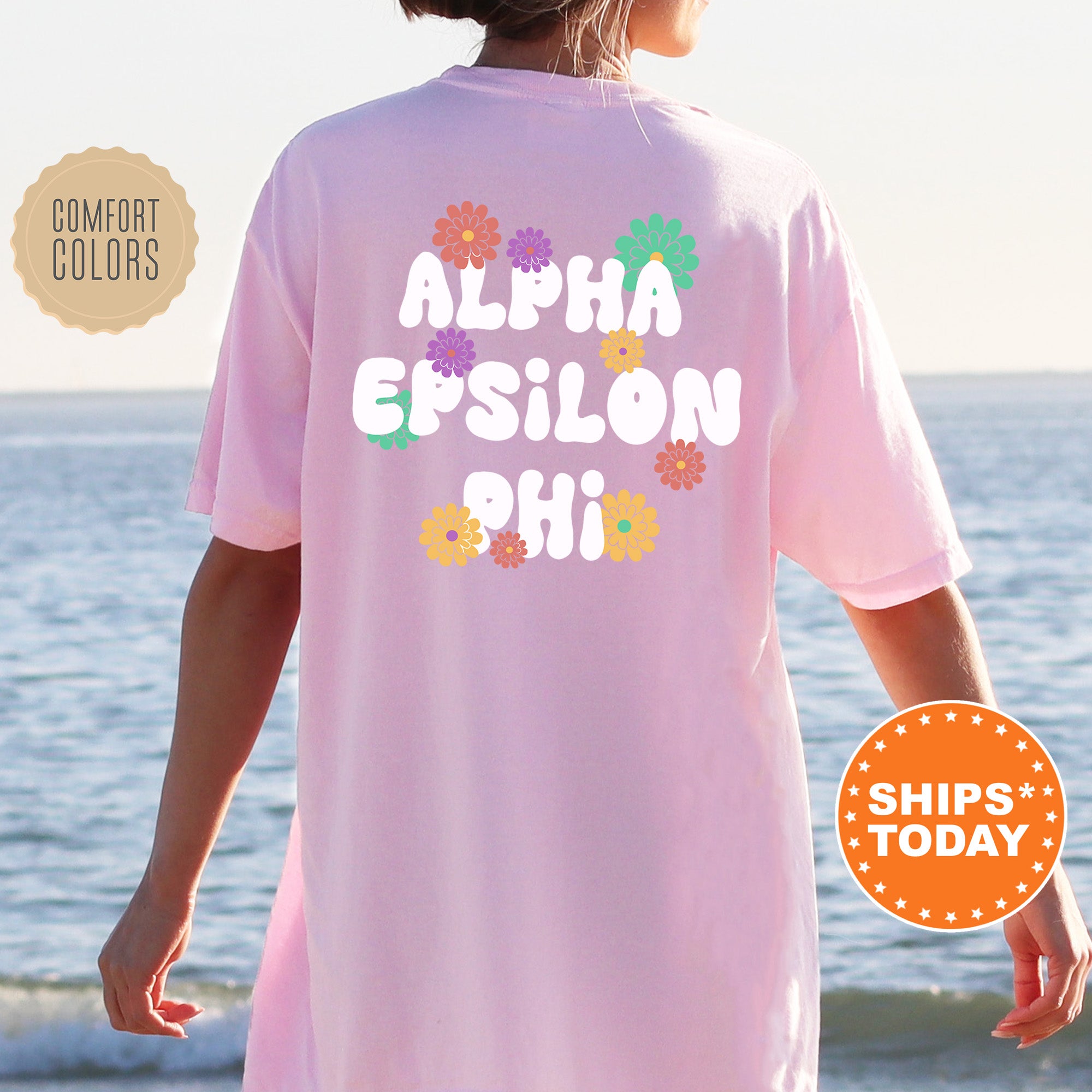 a woman wearing a pink shirt that says, aloh epsilon phi