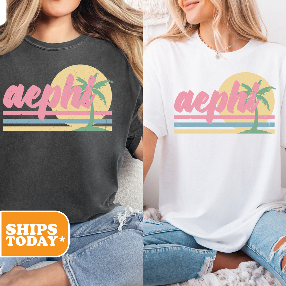 two women sitting on a bed wearing t - shirts