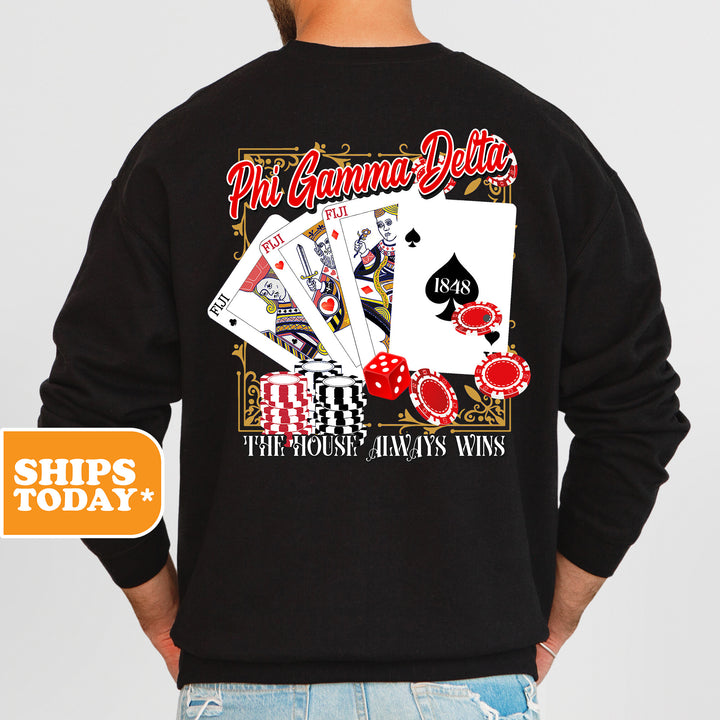 a man wearing a black sweatshirt with playing cards on it