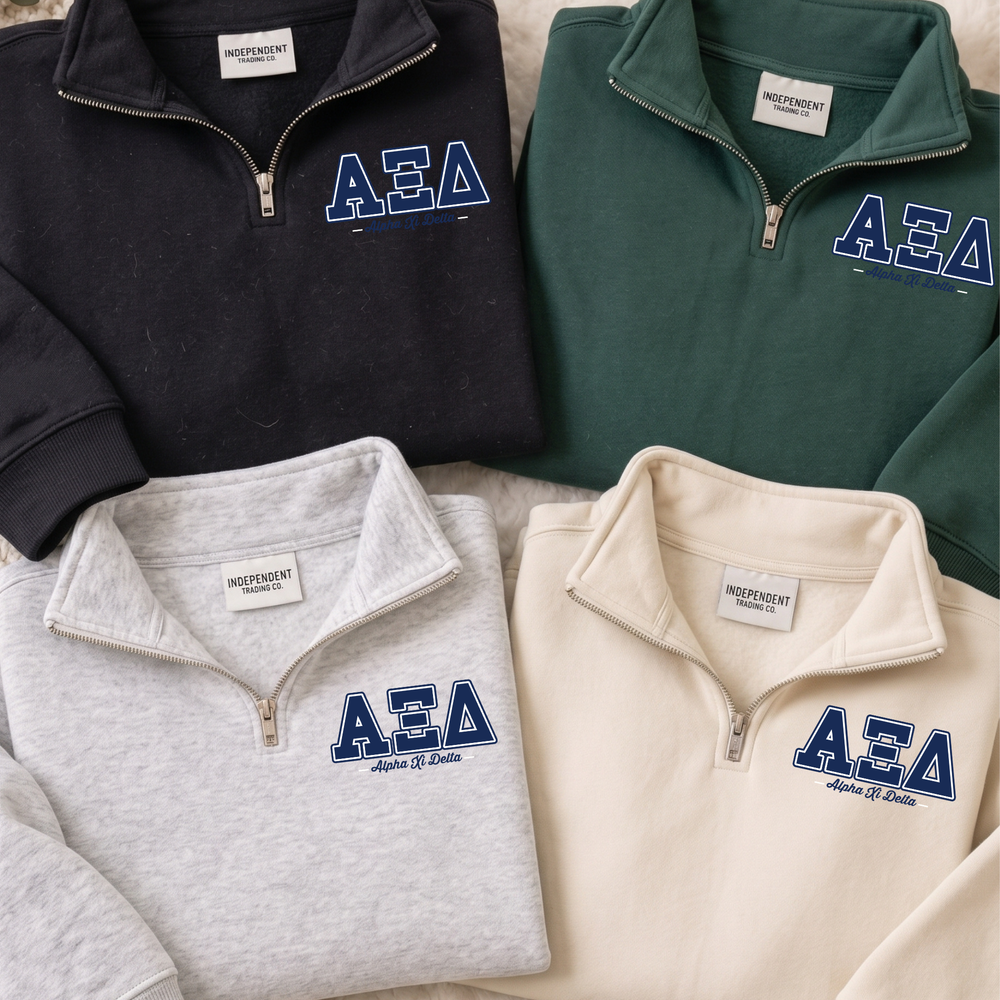 a collection of four zip-up sweatshirts, each with a different color and design, arranged side by side.