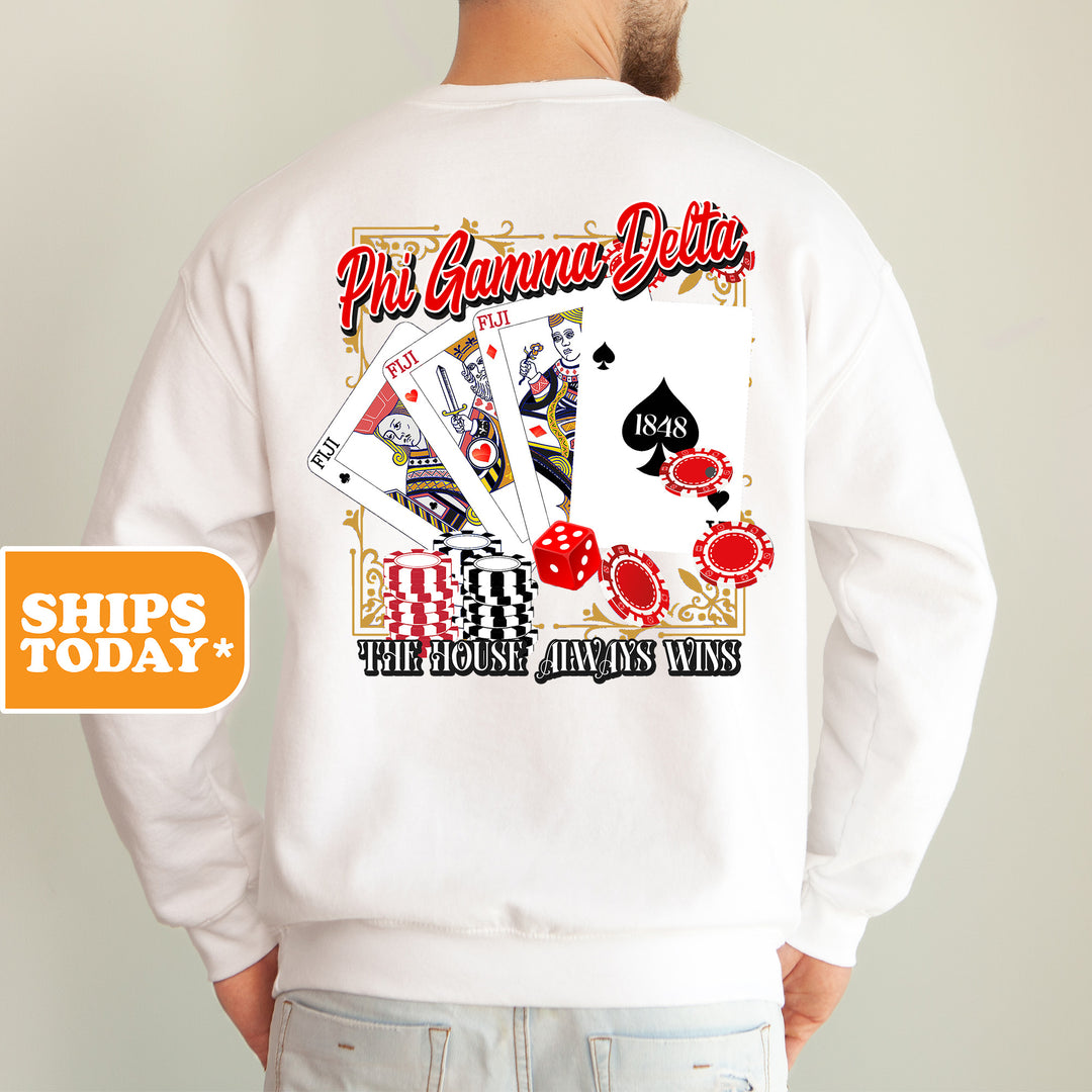 a man wearing a white sweatshirt with a picture of a deck of cards on it