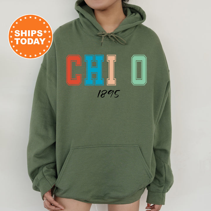 a woman wearing a green hoodie with the word chicago printed on it