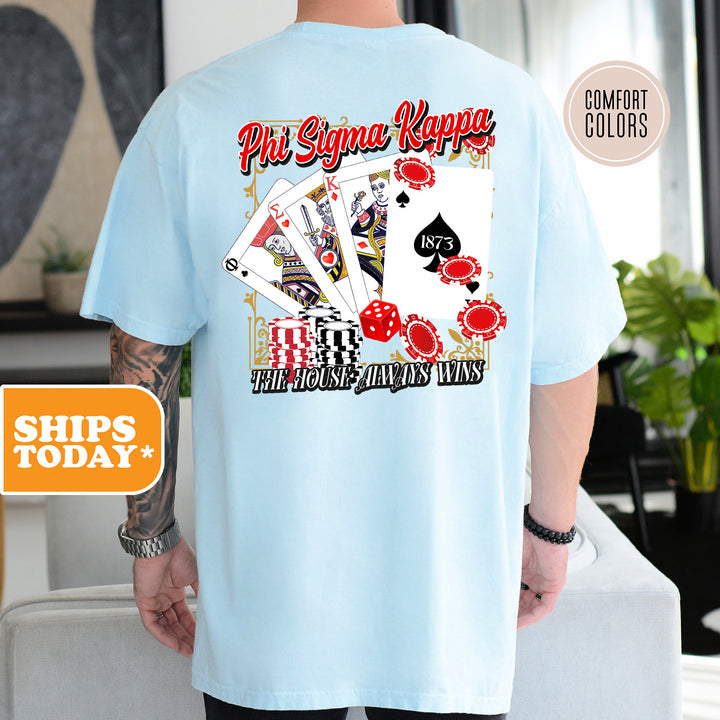 a man wearing a blue shirt with a playing card on it