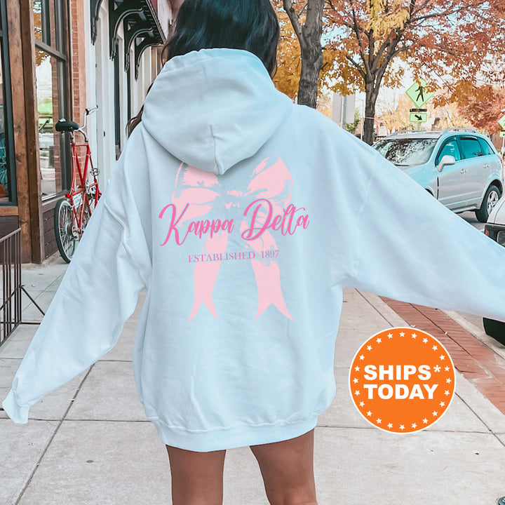 a woman in a white hoodie is walking down the street