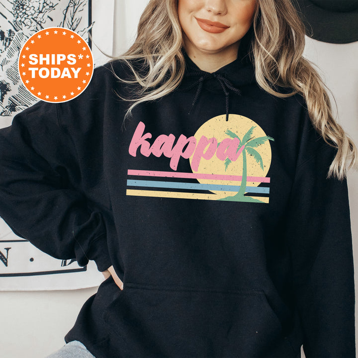 a woman wearing a black hoodie with the words kapa on it