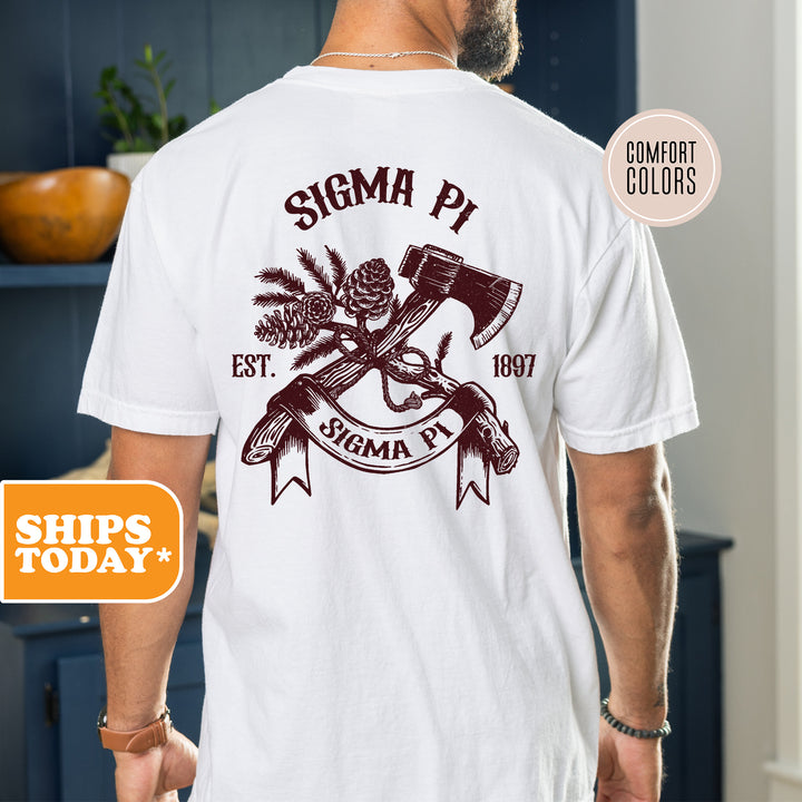 a man wearing a white shirt with an image of a hammer and two crossed axes
