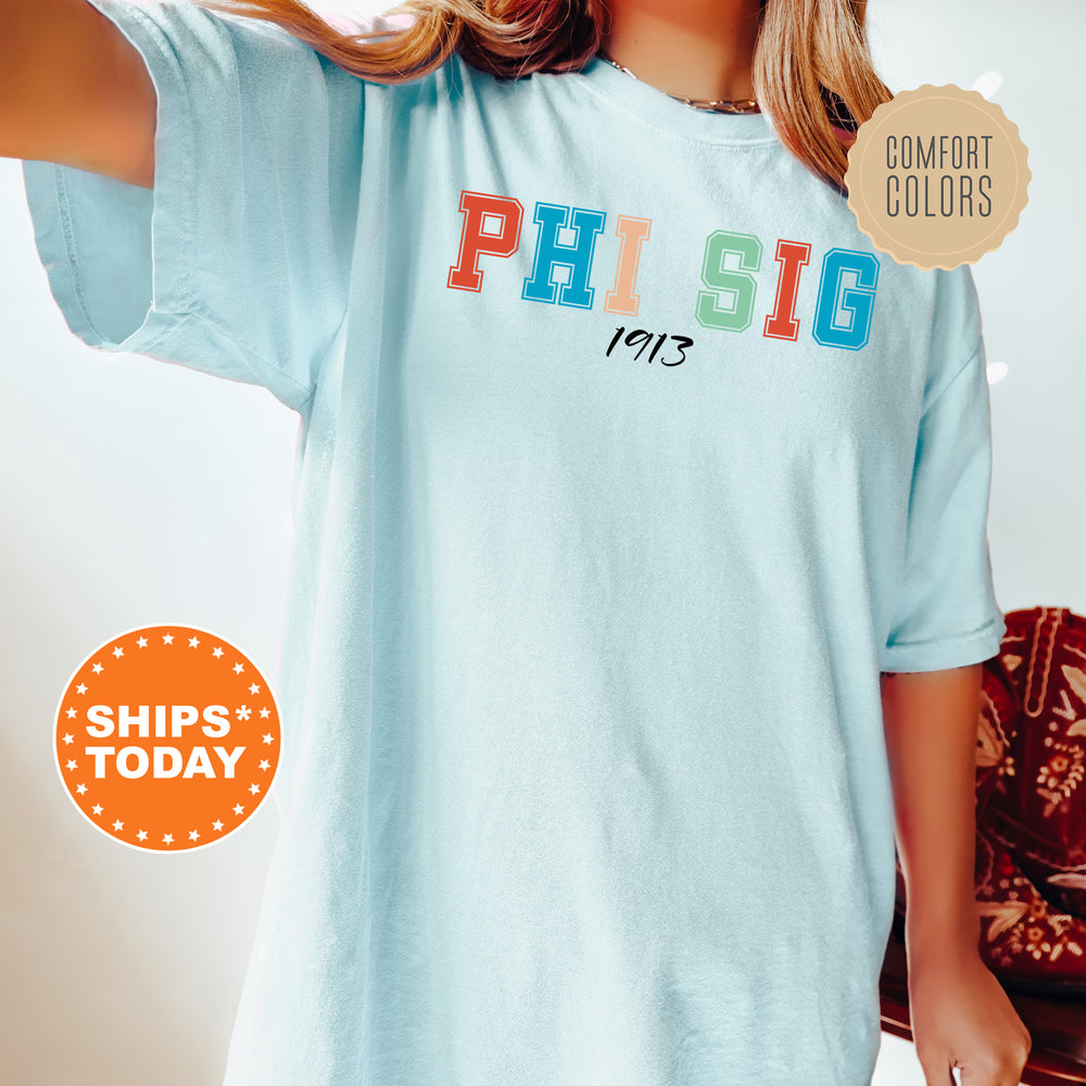a woman wearing a phi sig t - shirt