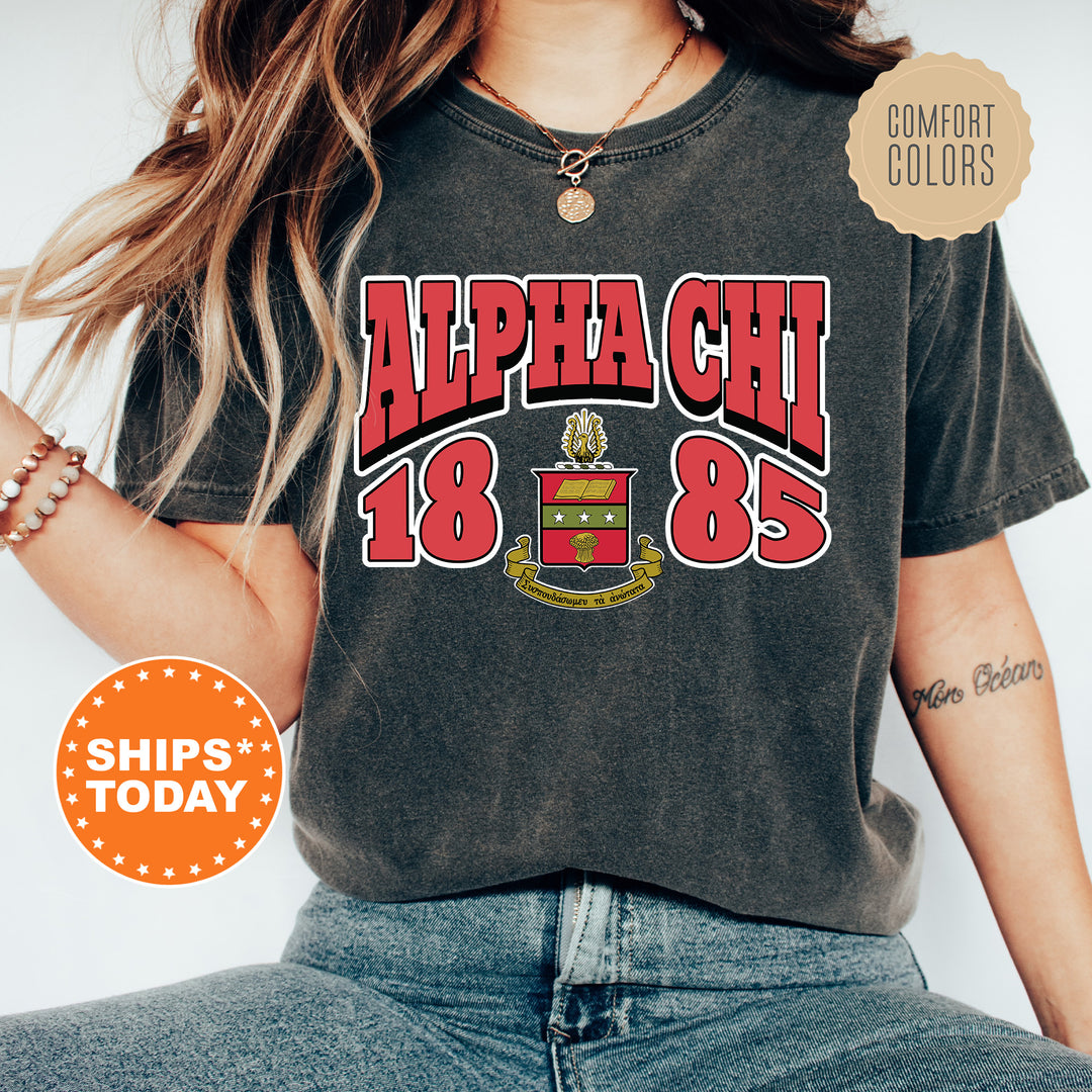 a woman wearing a black shirt with the words apha chi on it