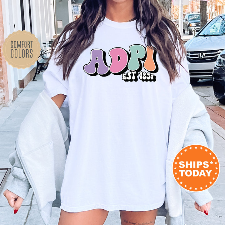 a woman wearing a white shirt with the word adopt on it