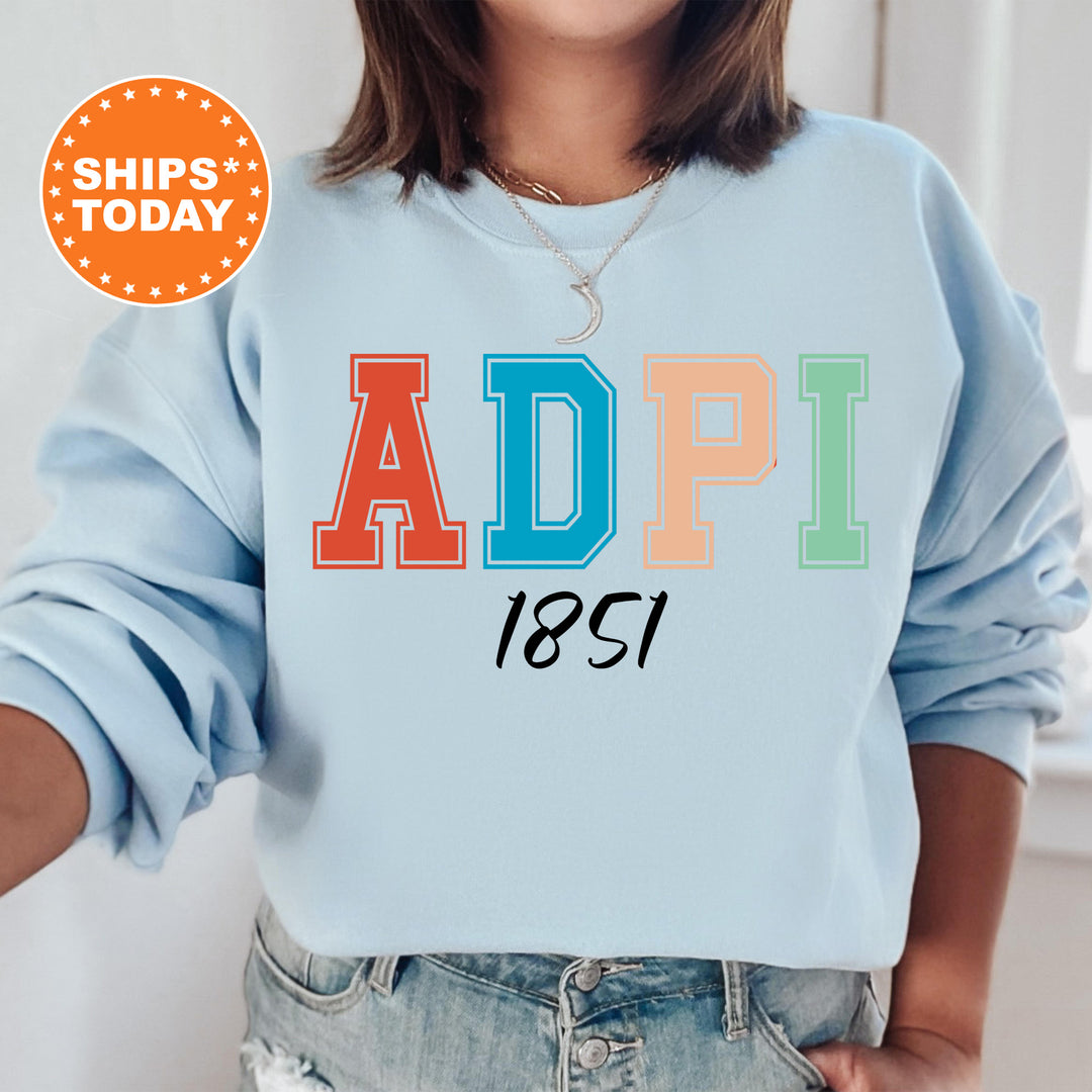 a woman wearing a blue sweatshirt with the word adpi printed on it