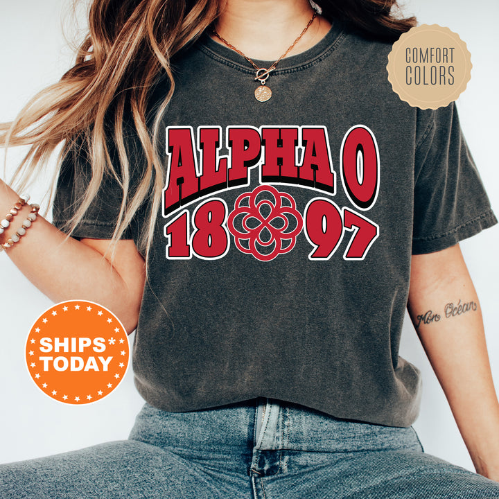 a woman wearing a black shirt with a red graphic on it