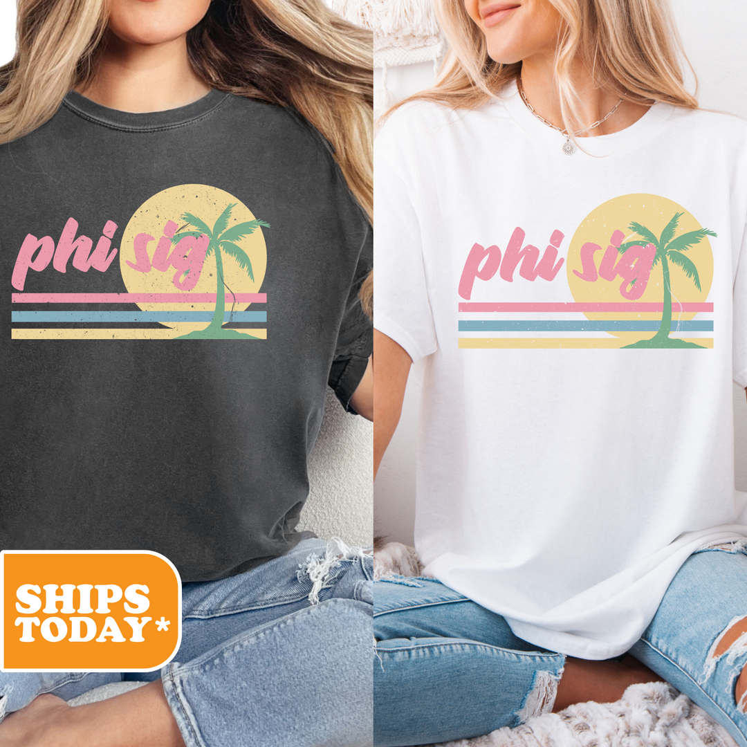 two women sitting on a bed wearing matching shirts