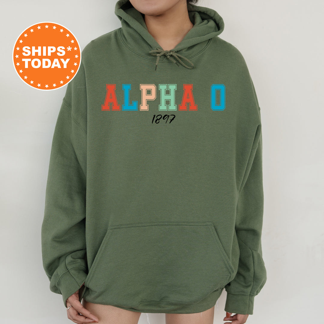 a person wearing a green hoodie with the word alpho printed on it
