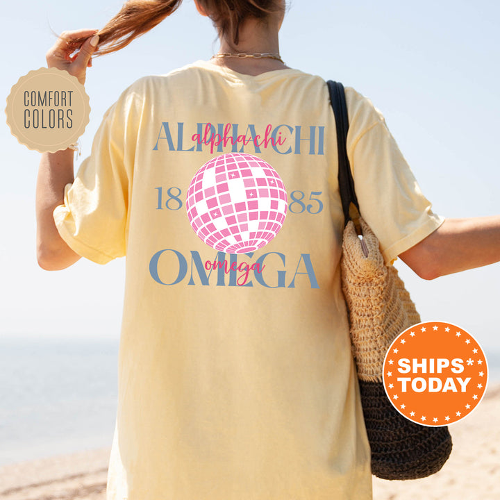 a woman walking on the beach with a t - shirt on