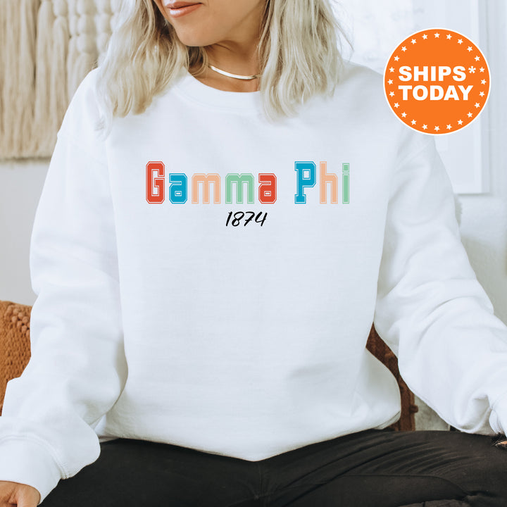 a woman sitting on a chair wearing a white sweatshirt