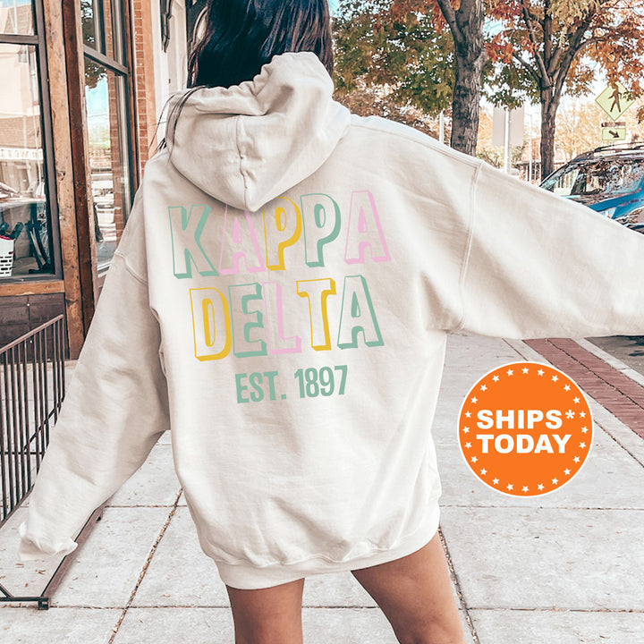 a woman in a white hoodie is walking down the street