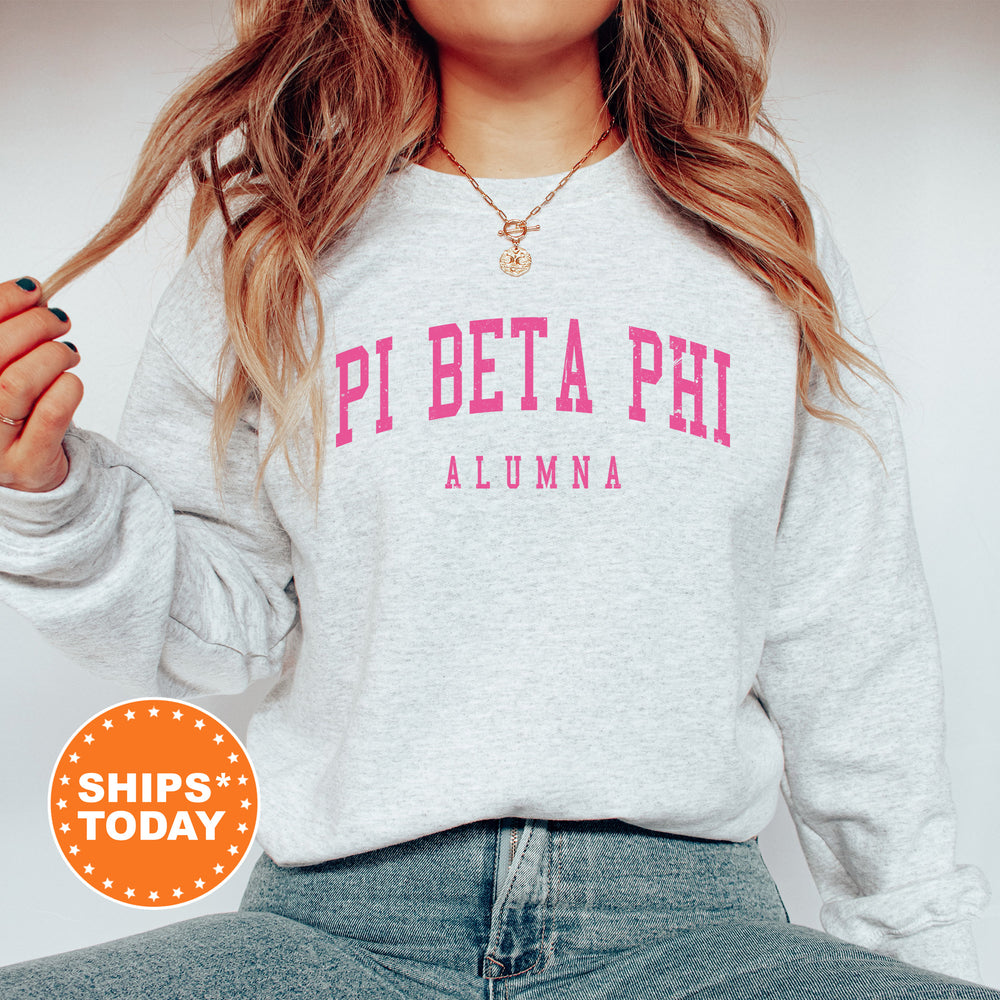 a woman wearing a sweatshirt with the word pi peta phi on it
