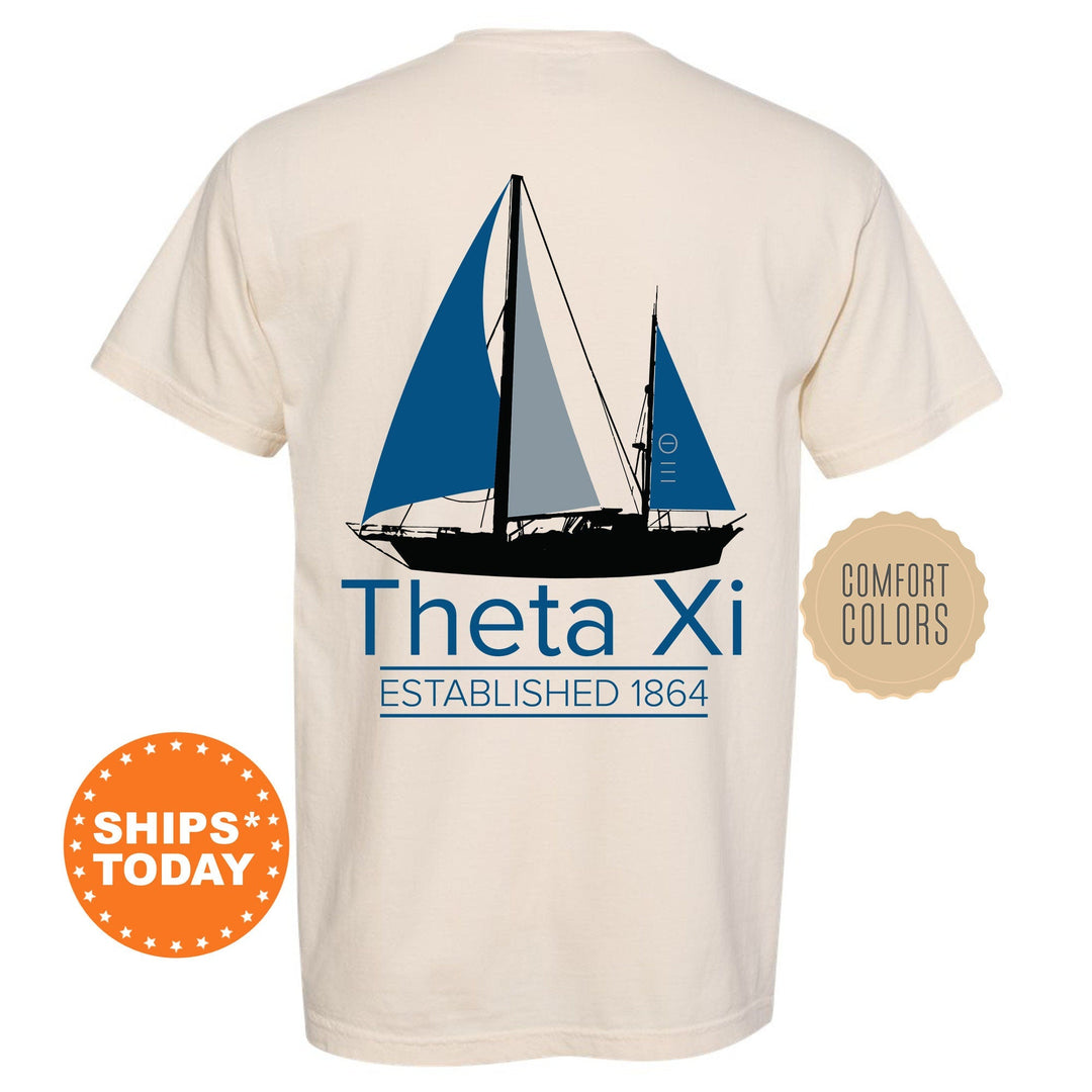 a white shirt with a blue sailboat on it
