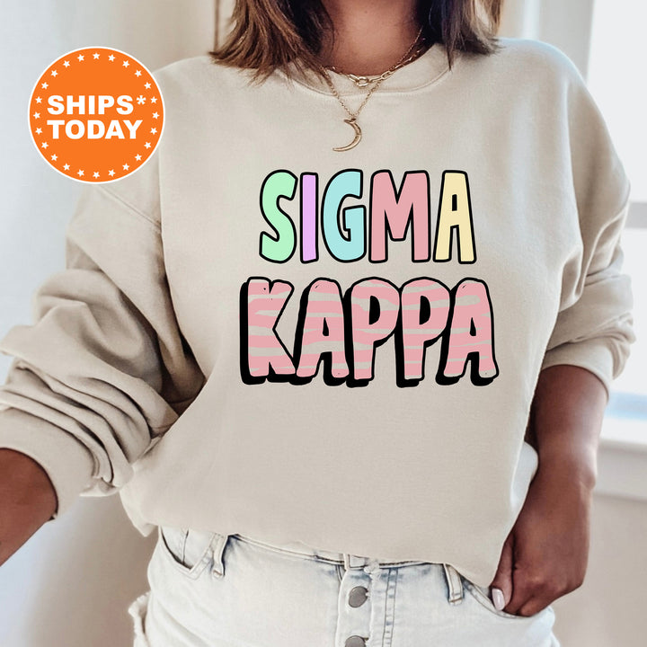 a woman wearing a sweatshirt that says stigma kappa