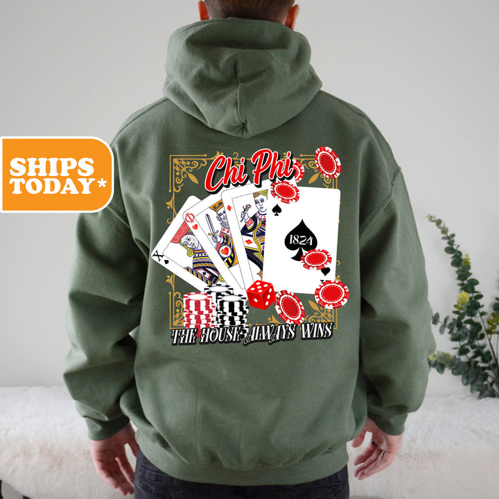 a man wearing a green hoodie with playing cards on it