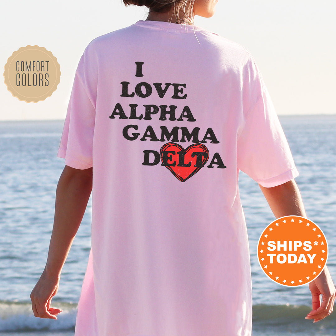a woman standing on a beach wearing a pink shirt