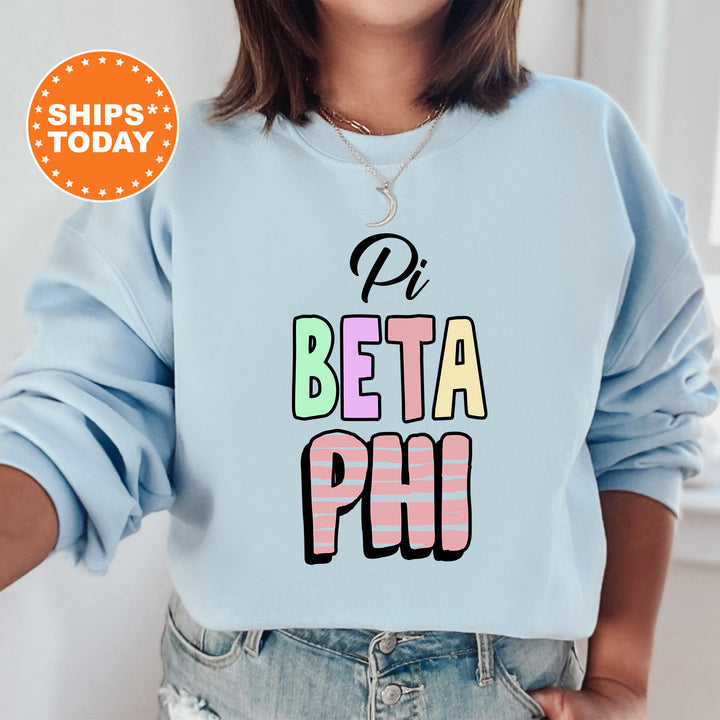 a woman wearing a sweatshirt that says pi beta phi