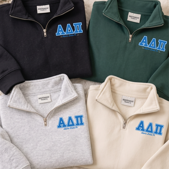 four different sweatshirts, each with the letters "AAI" printed on them. The sweatshirts are arranged in a row, with the first one being black, the second one being green, the third one being gray, and the fourth one being beige.