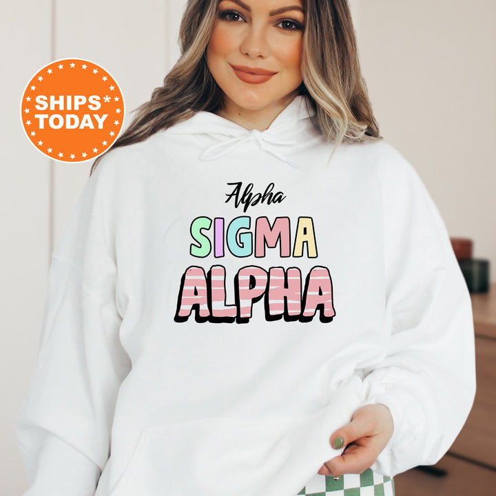 a woman wearing a white hoodie with the words stigmaa and a checkered