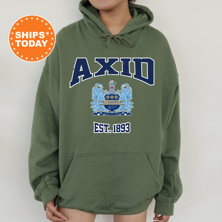 a person wearing a green hoodie with a picture of a coat of arms on