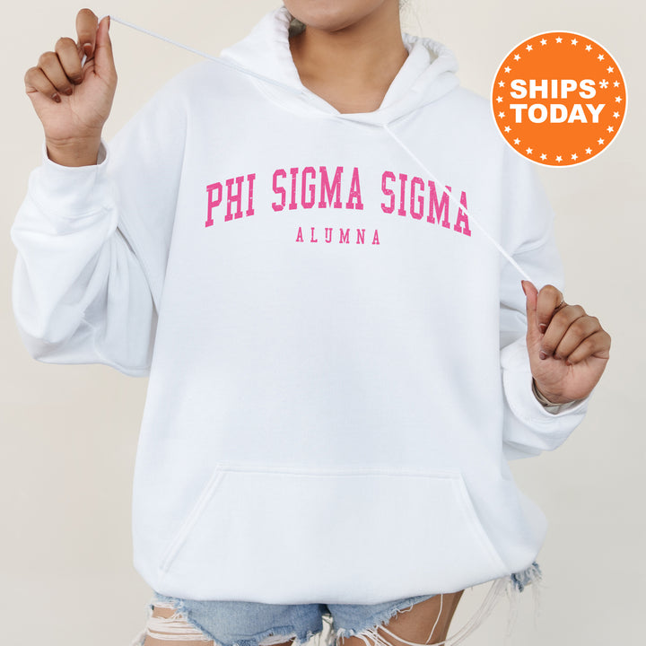a woman wearing a white hoodie with pink letters on it