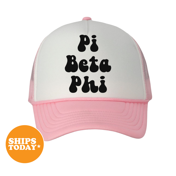 A white and pink baseball cap with the text "Pi Beta Phi" printed on it.