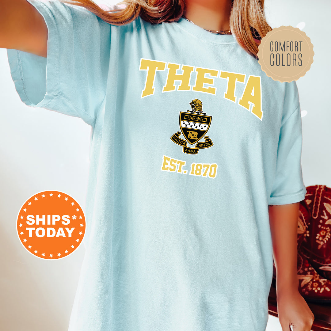 a woman wearing a blue tshirt with a boat on it