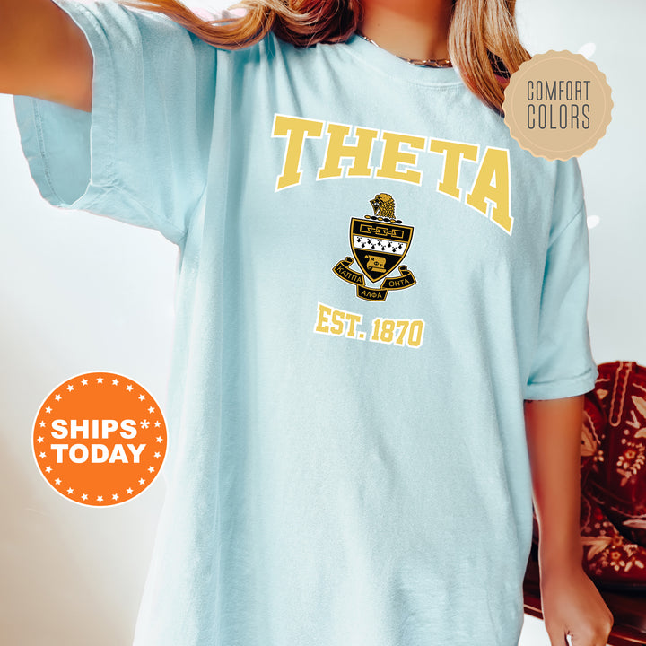 a woman wearing a blue tshirt with a boat on it