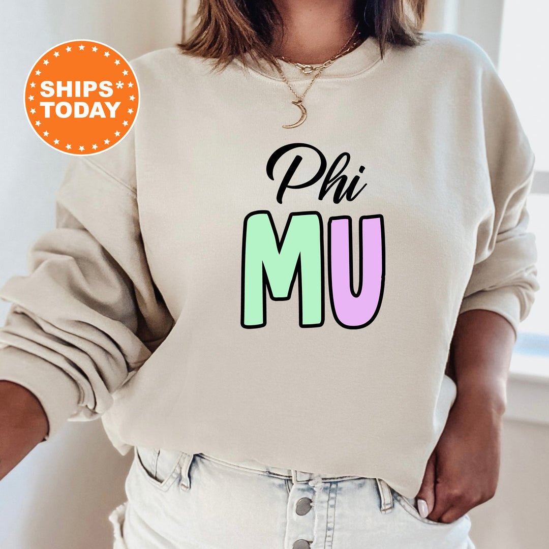 a woman wearing a sweatshirt that says phi mu