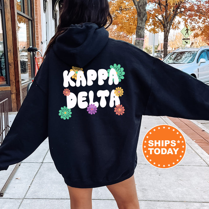 a woman in a black hoodie that says kappa delta