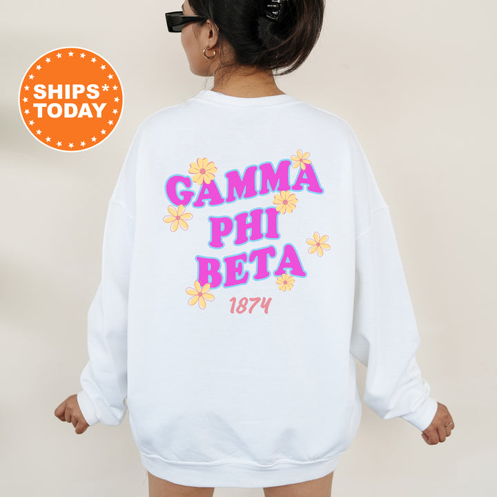 A woman wearing a white sweatshirt with the text "Gamma Phi Beta" and "1874" printed on it.