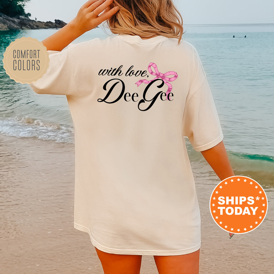 a woman standing on a beach wearing a t - shirt that says, with love