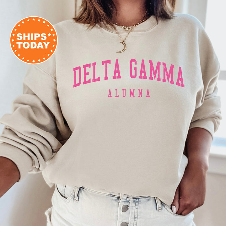 a woman wearing a sweatshirt that says delta gama