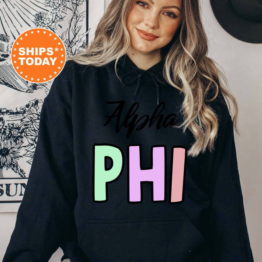 a woman wearing a black hoodie with the words aloha phi on it