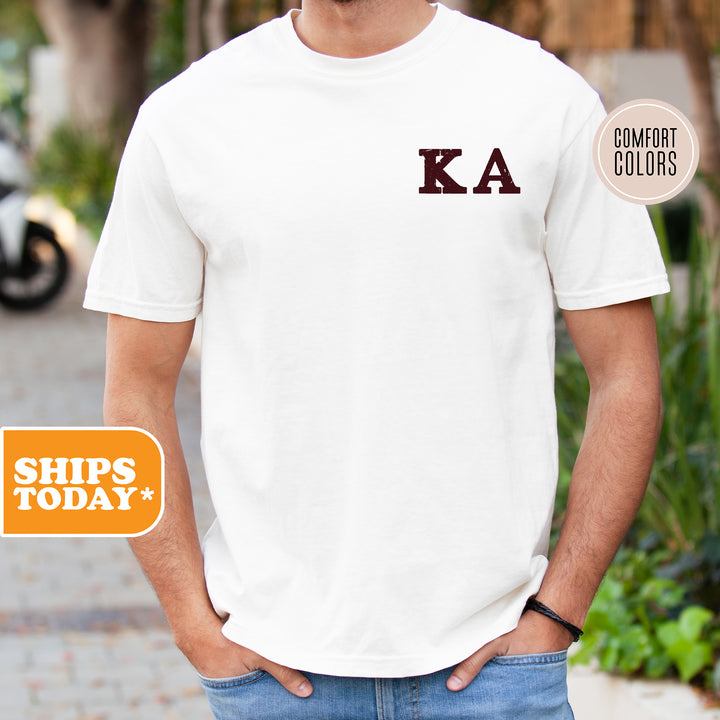 a man wearing a white shirt with the letters ka on it