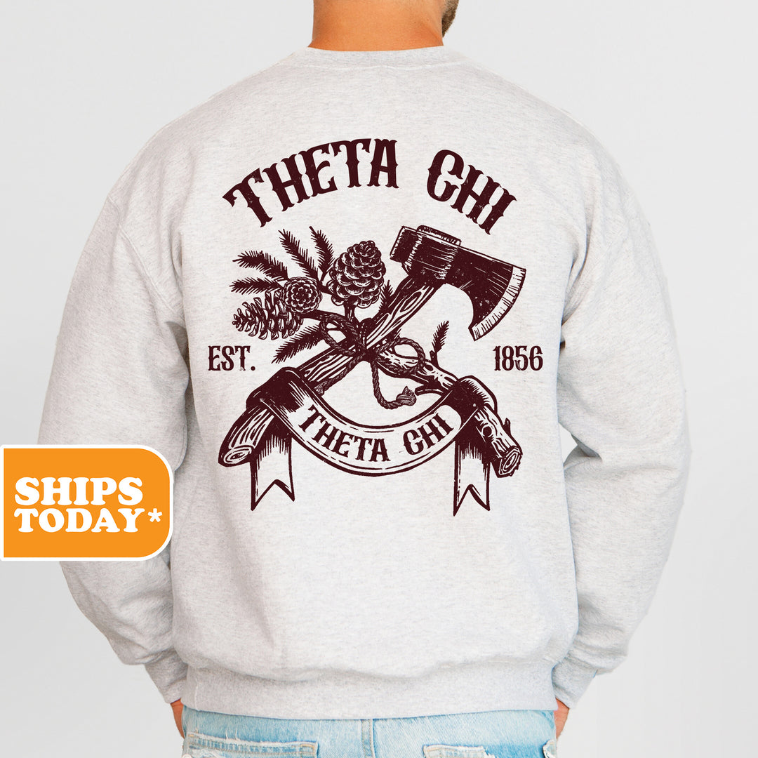 a man wearing a sweatshirt with an image of a hammer and pine cones on it