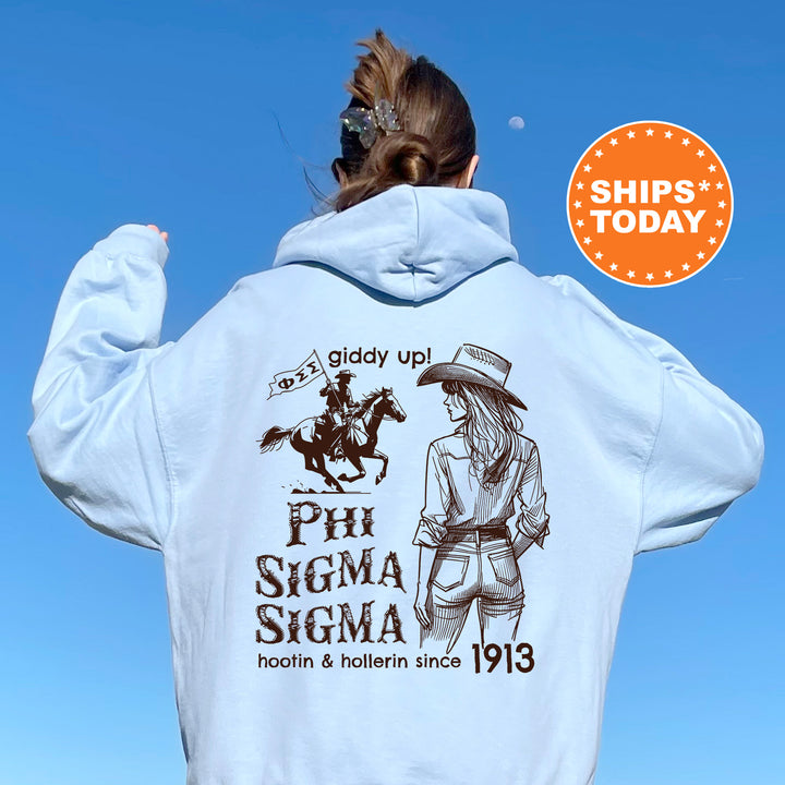 a woman wearing a white hoodie with a picture of a woman riding a horse