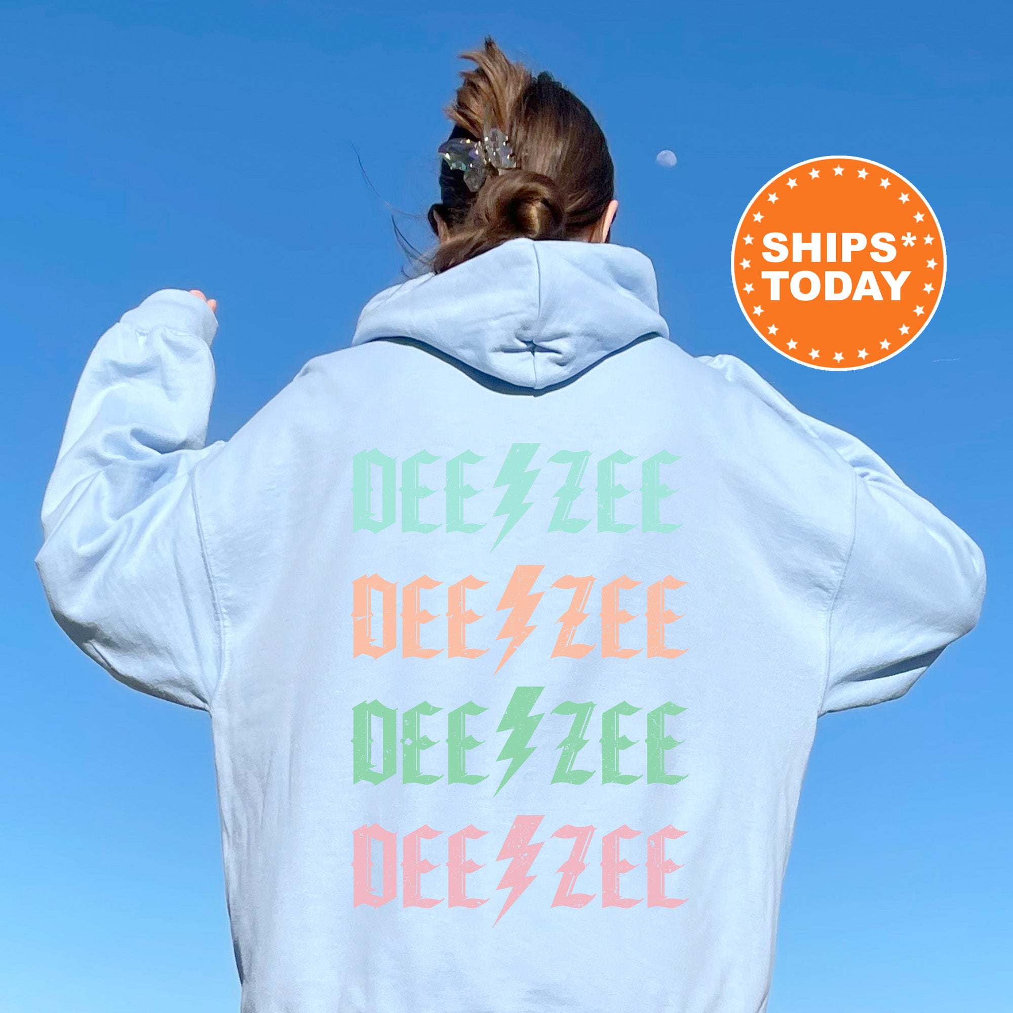 a woman wearing a white hoodie with the words dee zee dee dee dee dee